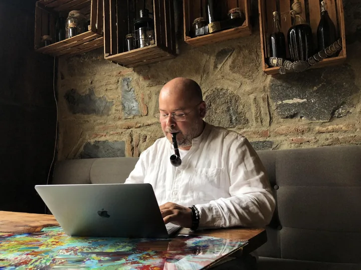 Alexey Borealis at work with a laptop