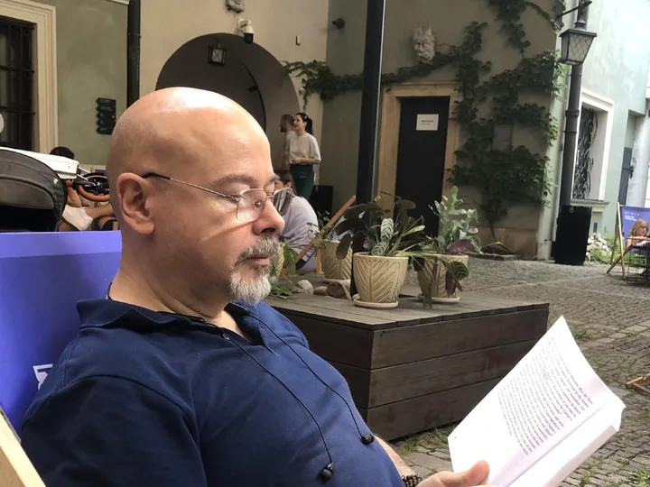 Alexey Borealis reading a Latin translation of an astrological text
